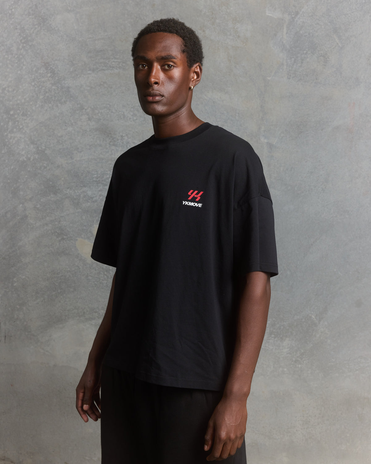 YK Move Keep Stacking Days Evolve Tee | Black